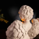 bougeoir en forme d'ange prie